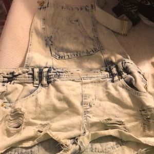 Light wash ripped jean overalls